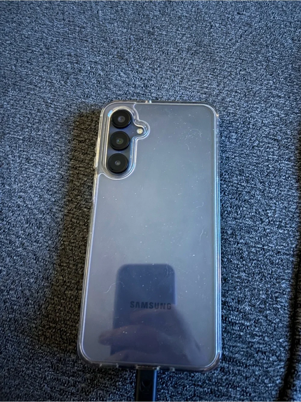 Samsung Smartphone in Black with Blue-Green Wallpaper